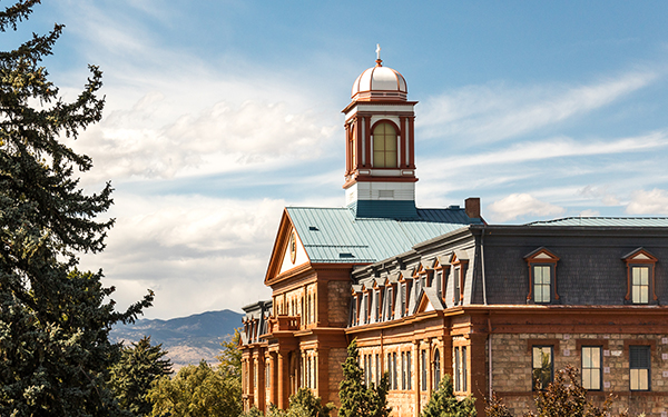 College building in front of mountains